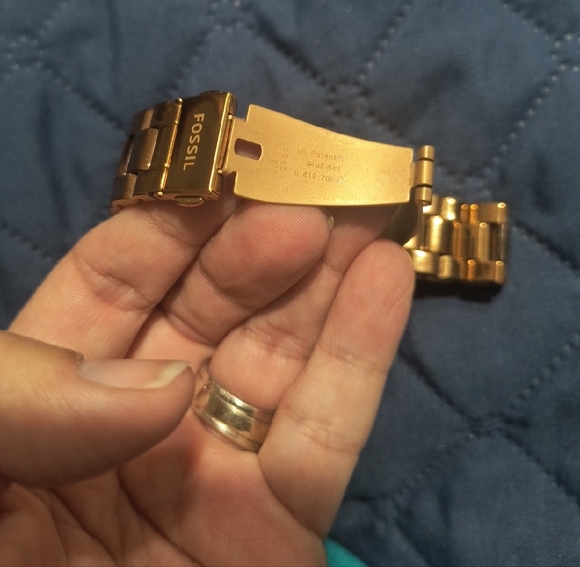 Gold Smartwatch with Black Charging Cable